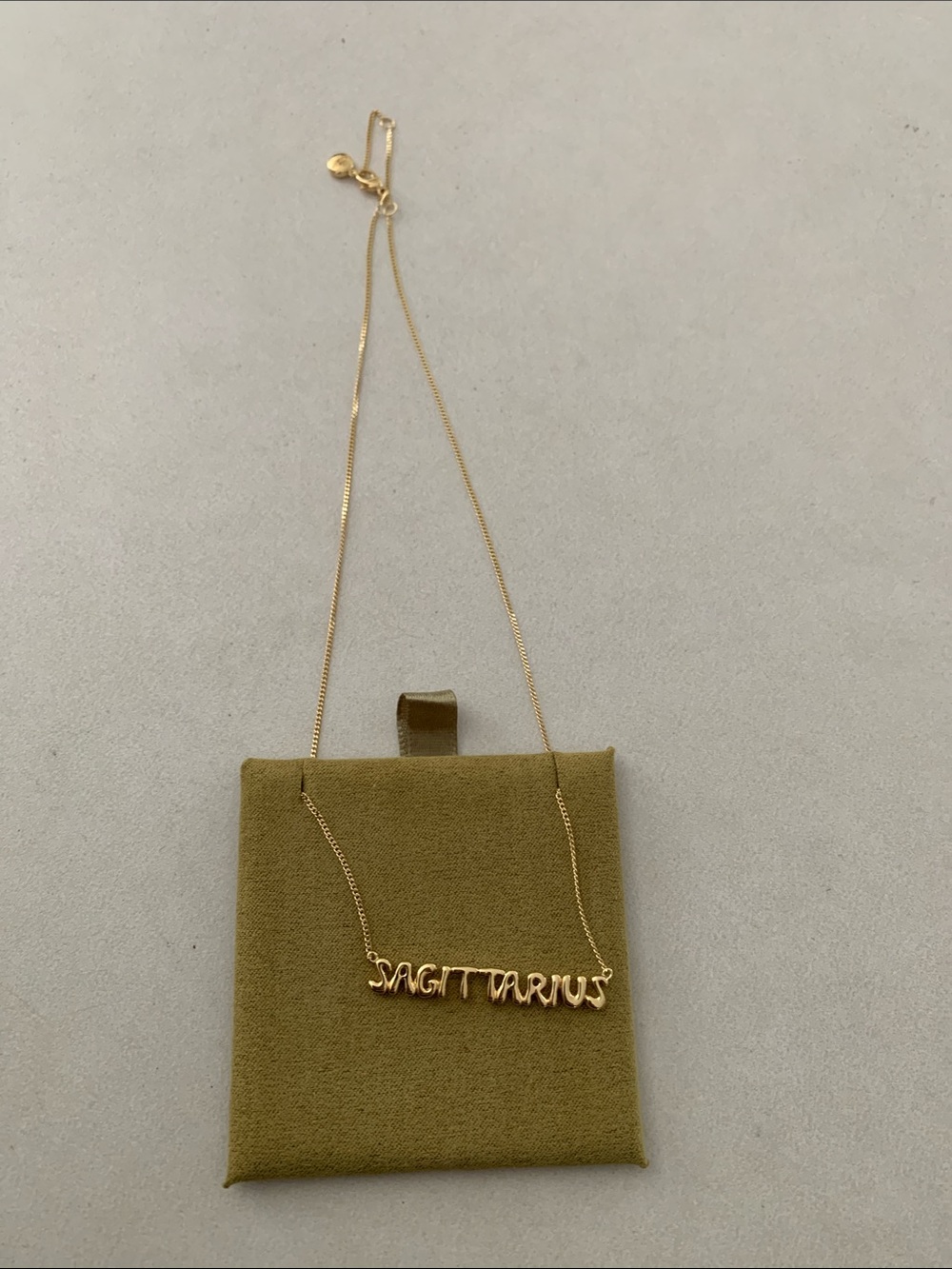 Gold Sagittarius Script Necklace by Modandjo